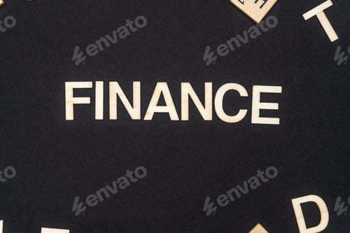 Preview: FINANCE word written on dark paper background. FINANCE text for your concepts