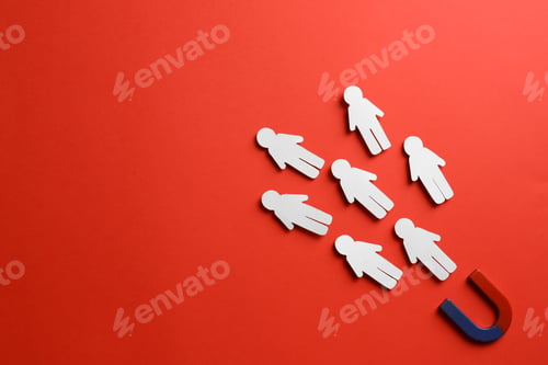 Preview: Magnet attracting paper people on red background, flat lay. Space for text