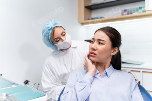 Preview: Caucasian dentist examine tooth for young girl at dental health clinic.