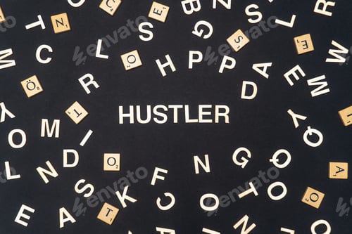 Preview: HUSTLER word written on dark paper background. HUSTLER text for your concepts