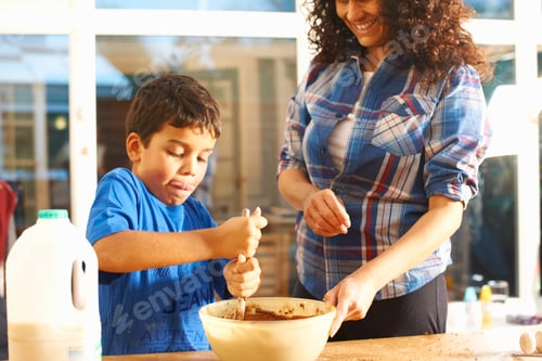 Preview: Mother and son baking in kitchen