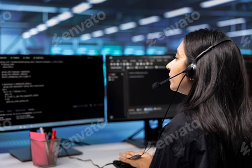 Preview: Woman at work in server hub chatting with on field engineer in mic