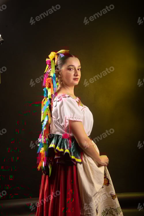 Preview: A woman wearing a colorful dress with a long ribbon in her hair
