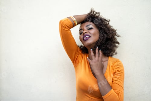 Preview: portrait of african woman posing and looking at the camera, copy space