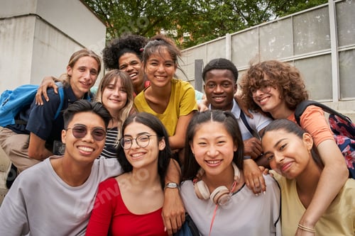 Preview: Selfie of a group of students looking at the camera smiling. Happy to be back to school.