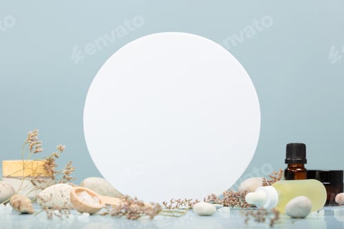 Preview: Composition with bottles of essential oils, facial serum, creams on table with stones and flowers