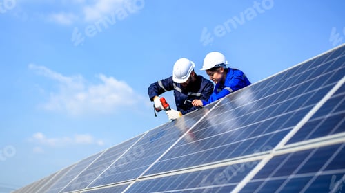 Preview: Technicians workers installing solar panels at solar cell farm