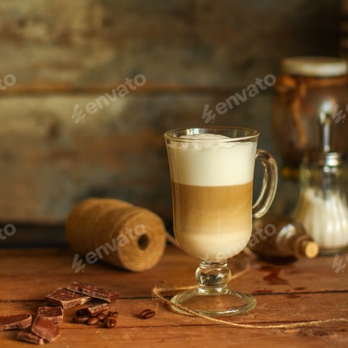 Preview: Latte - A Cup Of Coffee With Milk In A Transparent Cup On The Table. Top View.