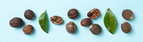 Preview: Concept of spices and condiments, nutmegs, top view