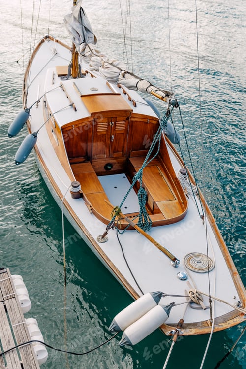 Preview: Luxury Classic Sailing Boat with wooden interior, in blue waters.