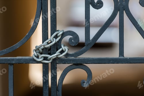 Preview: Ornamental iron gate locked with chain. ❤️ nominated 💔