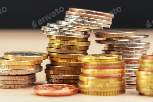 Preview: piles of coins on working table