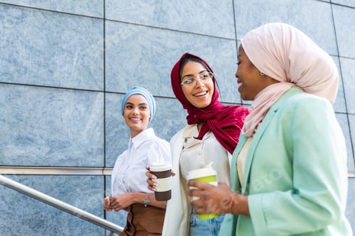Preview: Beautiful muslim girl wearing hijab bonding outdoors
