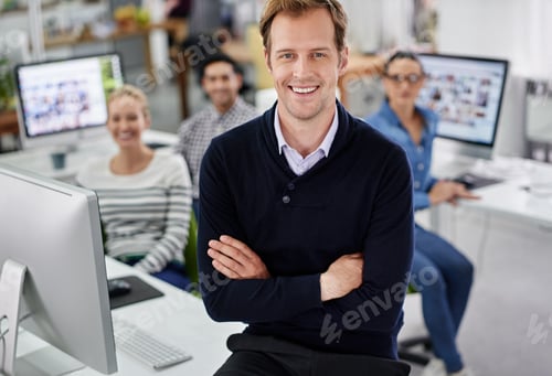 Preview: Cropped portrait of a smiling businessman with his colleagues in the background
