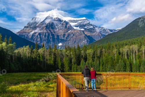 Preview: Tourists admiring mount robson in the canadian rockies, british columbia
