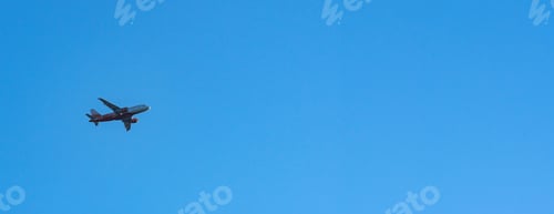 Preview: Airplane flying in the blue sky. Concept of fast travel, holidays