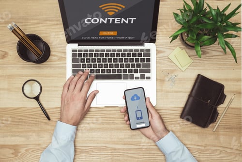 Preview: top view of businessman working with laptop, smartphone and diary at workspace