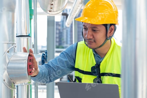 Preview: Engineer under industrial inspection Large water heaters are used in high-rise condominiums