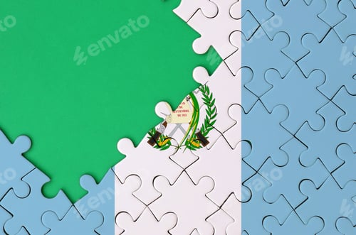 Preview: Guatemala flag is depicted on a completed jigsaw puzzle with free green copy space on the left side