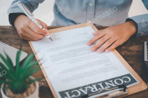 Preview: business man's hand is signing a contract In the agreement
