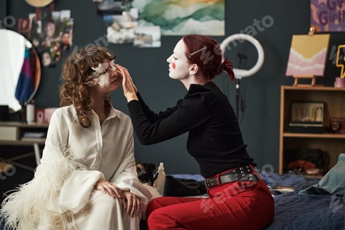 Preview: Caucasian Gen Z Girls Creating Creative Makeup Looks in Cozy Bedroom Setting