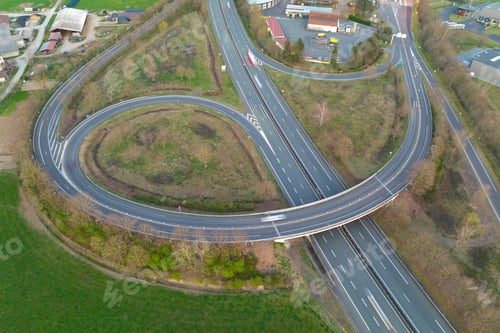 Preview: Aerial view of highway road intersection with fast moving heavy traffic.
