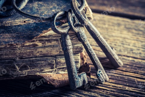 Preview: Old books and keys on old wooden table