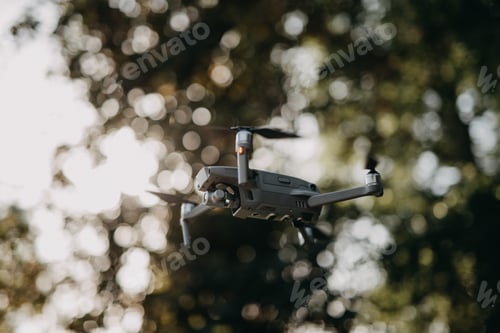 Preview: Flying drone with a camera on a blurred background