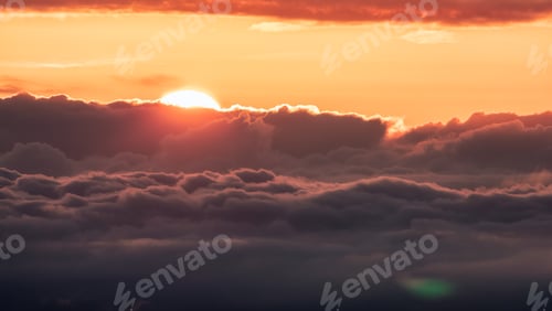 Preview: Orange Sky Above Clouds at Sunrise or Sunset