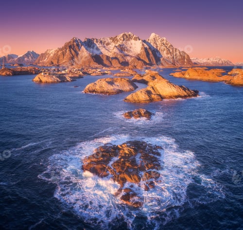 Preview: Aerial view of rocks in sea waves, Henningsvaer city, mountains
