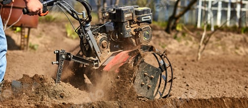 Preview: Man working in the garden with Garden Tiller.