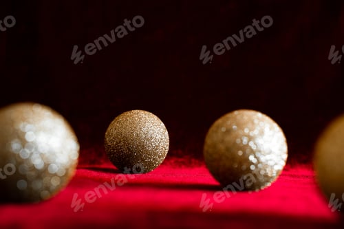Preview: Gold christmas balls on red background
