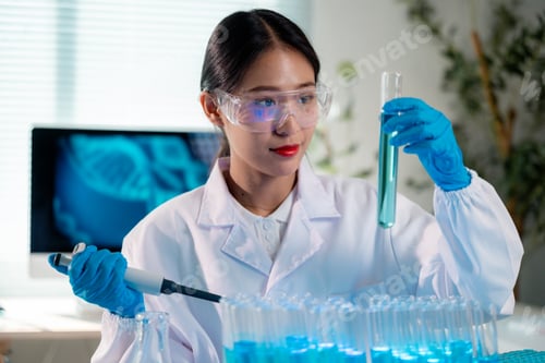 Preview: Scientist working with test tubes and pipette in laboratory