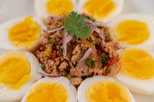 Preview: Half boiled egg and Pork Larb on a plate