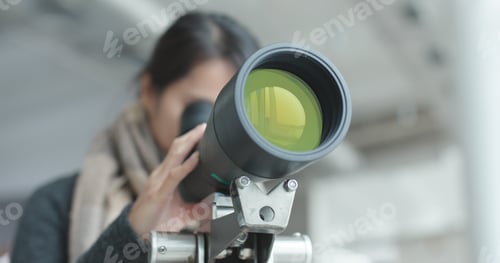 Preview: Young Woman observe through telescope