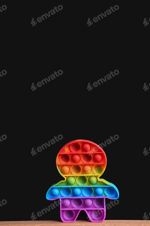 Preview: rainbow toy pop it on a black background. mock up