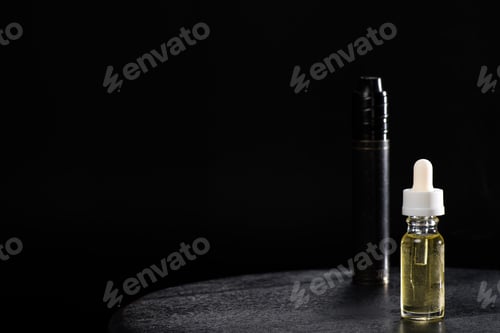 Preview: Electronic cigarette and liquid isolated on black