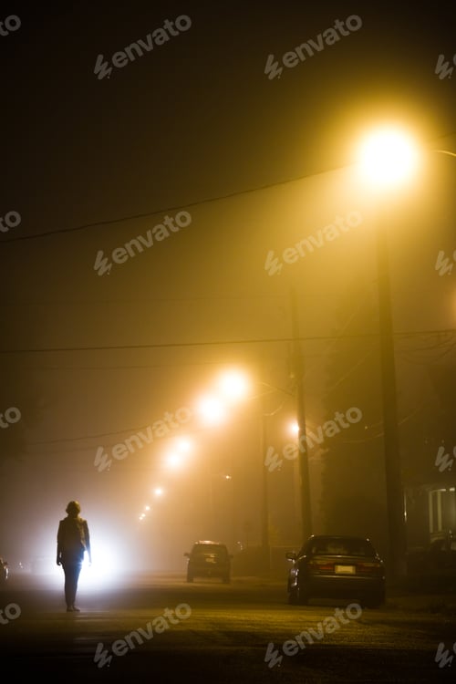 Preview: Woman alone in the foggy street