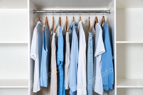 Preview: Clothes Hanging in a Closet with Wooden Hangers