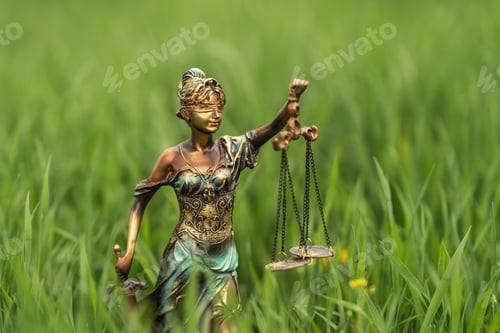 Preview: Statue of Themis on a green grass background. Symbol of justice and law, crime and punishment.