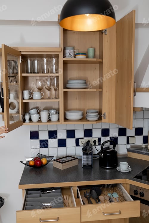 Preview: Open cabinets in the kitchen set with dishes and cutlery