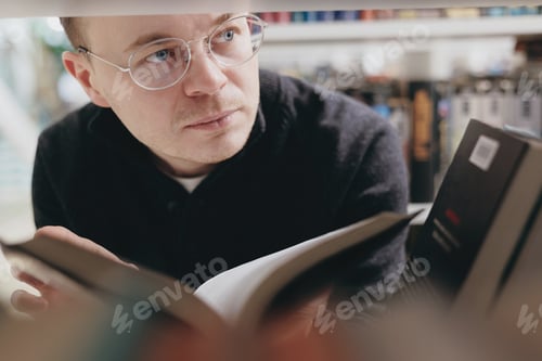 Preview: a young adult male teacher or scientist is engaged in scientific activity or resting