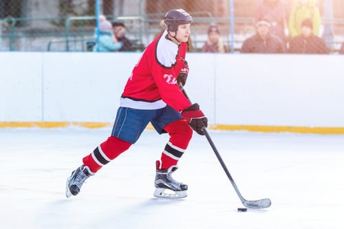 Preview: Professional ice hockey player in attack on the rink