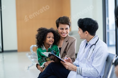 Preview: A male doctor in a medical uniform is discussing something with a patient in the hospital.