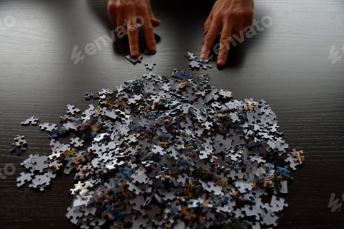 Preview: Puzzle pieces with hands