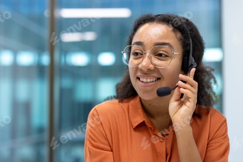 Preview: Woman working in customer service with a headset in a modern setting