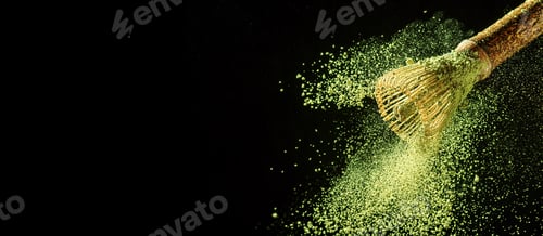 Preview: Bamboo whisk with flying matcha tea powder on black background with copy space.