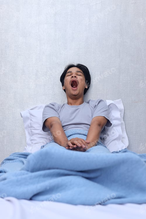 Preview: Attractive guy is stretching and yawning in bed