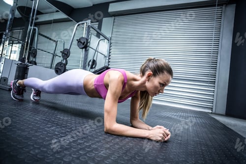 Preview: Side View Of A Muscular Woman On A Plank Position