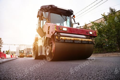 Preview: Paving New Asphalt Surface on a City Street With a Heavy Roller